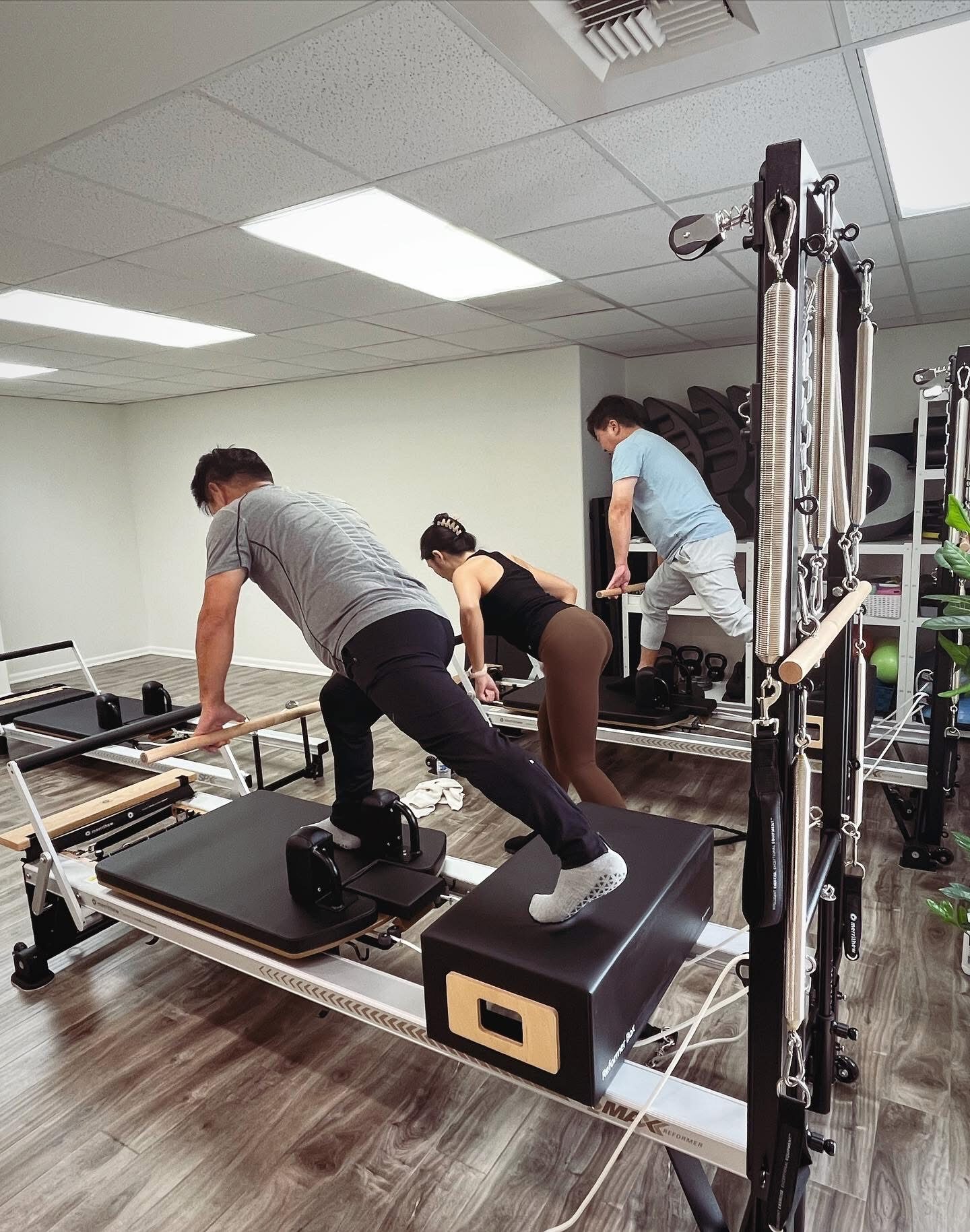Members working through a guided class together in the studio.