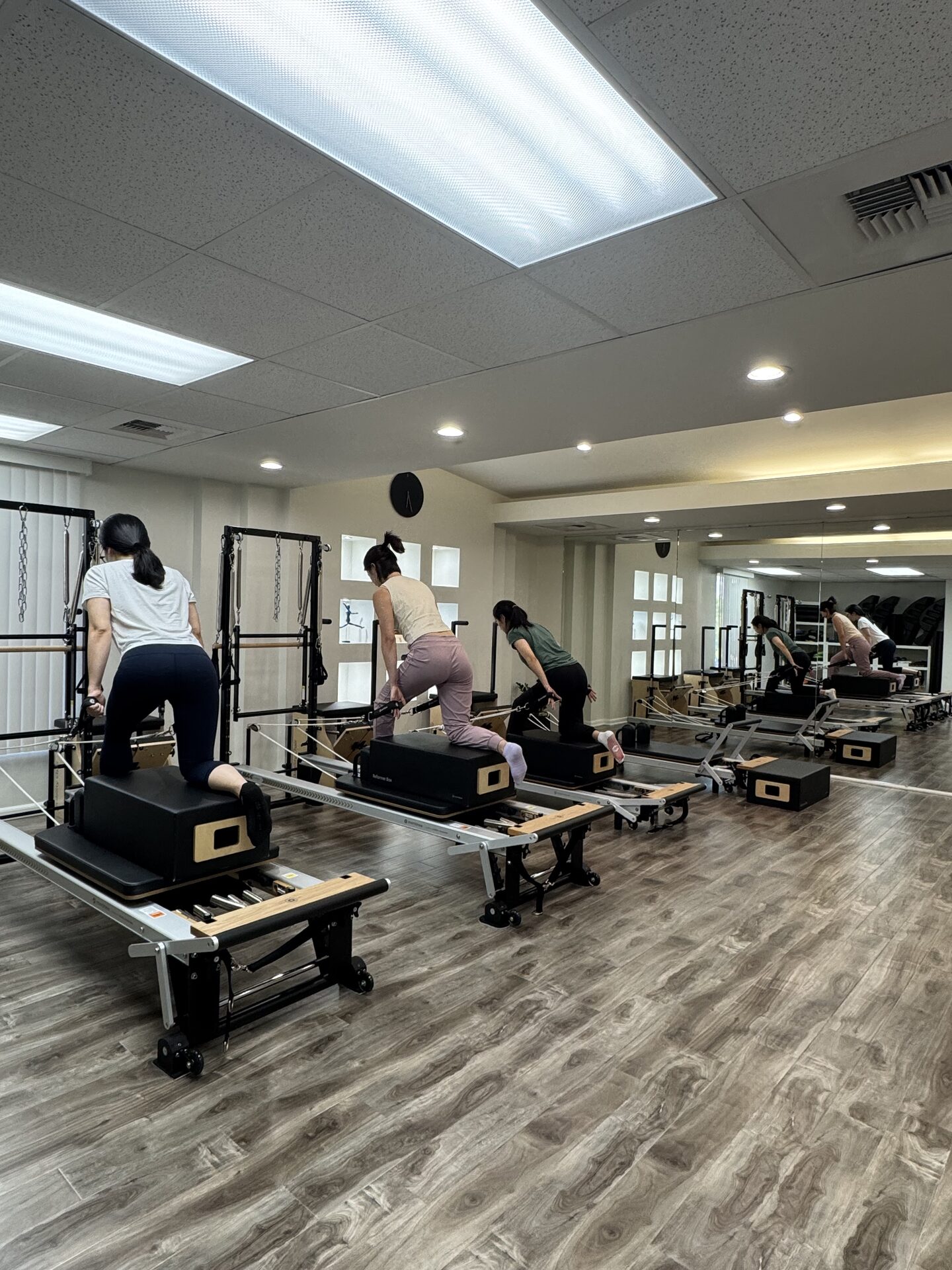 A small group class in session on the reformers at the Buena Park studio.